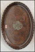 An early 20th century Hugh Wallis arts and crafts hammered copper and silver white metal tray, of
