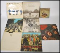 Vinyl Records - The Beatles, a collection of vinyl long play LP records pertaining to the Beatles to