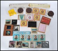 A collection of vintage 20th Century magic lantern slides to include a boxed set of Fry's Boys,