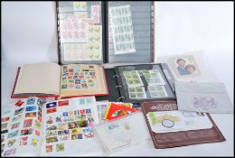 A collection of stamps to include album of unused modern stamps, first day covers, loose kiloware,
