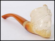 An early 20th century meerschaum smoking pipe in the form of a man wearing a turban. Measures
