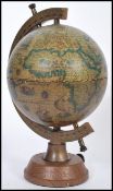 A vintage antique style drinks decanter globe featuring a classical map globe with hidden musical
