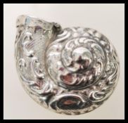 A silver plated vesta case in the form of a snail with embossed foliate detailing. Weight 16.4g.