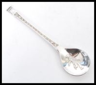 A vintage 20th century silver hallmarked The 1976 John Pinches Christmas Spoon complete in