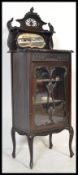 A Victorian mahogany pedestal pier display cabinet. The glass door housing enclosed shelves.