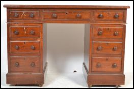 A Victorian 19th century mahogany twin pedestal desk of small proportions. Raised on plinth bases to