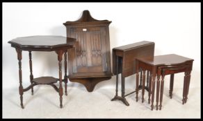 A collection of furniture to include an Ercol hanging corner cabinet, Sutherland table, nest of