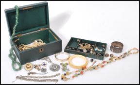 A selection of vintage costume jewellery to include two art deco style marcasite bracelets, two