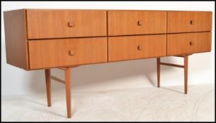 A 20th Century retro teak wood Sideboard / Credenza, having an arrangement of six drawers raised