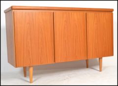 A retro 20th Century Danish three door teak wood Skovby sideboard, the left hand side cupboard