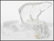 A Hadeland Glassverk Norsk Krystall Polar Bear raised on large ice pedestal base with original