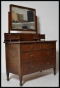 A late Victorian / Edwardian mahogany dressing table chest of drawers. The large swing mirror