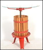 A 20th Century contemporary side table / coffee table modelled as a cider press / cheese press,