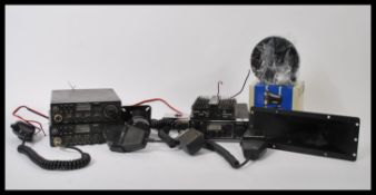 A group of vintage CB radios to include a Uniden PC404 , a pair of CB radios, headphones and
