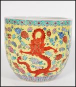 A large 19th century Chinese brush pot / vase having famille Juane enamelled ground with