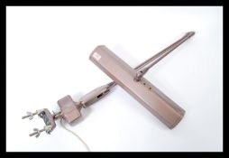 A vintage mid 20th Century Industrial factory work lamp of anglepoise construction, marked to the