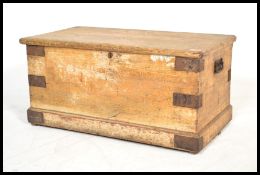 A 19th Century Victorian scrumble finished pine trunk / work-box, hinged top raised on a plinth