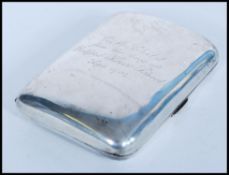 An early 20th century silver hallmarked cigarette case of curved rectangular form. Hallmarked for