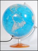 A vintage retro 20th century desk top globe raised on a circular wooden base. 44cm-high.