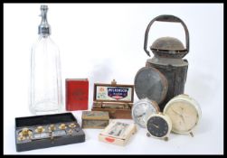 A collection of vintage items to include a vintage early 20th century railway lamp, vintage alarm
