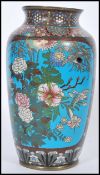 A 19th century Chinese cloisonne vase with blue enamelled panels to the sides depicting peonies