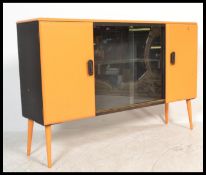 A retro 20th century painted yellow and black sideboard cabinet having two tone colourway being