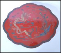 A good early 20th century Japanese large red and gold lacquer lozenge shaped rug / robe box with