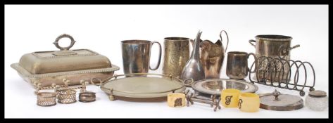 A selection of silver plate wares to include a William Hutton & Sons wine funnel , a early 20th