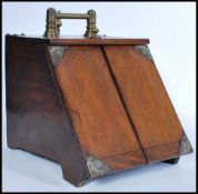 A 19th century Victorian oak coal scuttle box having metamorphic twin door lever action complete