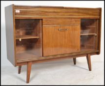 A vintage 20th Century walnut cased radiogram unit, having a later conversion in to a drinks cabinet