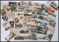 A good collection of vintage postcards dating from the early 20th Century to include Military,
