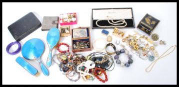 A vintage silver hallmarked and blue enamel dressing table set along with a collection of vintage