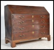 An 18th century George III large mahogany bureau being raised on bracket feet with chest of