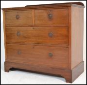 An early 20th Century Edwardian mahogany two over two chest of drawers, raised on bracket feet.