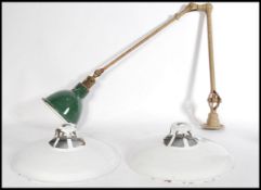 A vintage 1940's Dugdills engineers lamp, articulated tubular iron frame, with original paint work