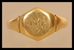 An early 20th century hallmark 18ct gold gentlemans signet ring. The ring has notation on the inside