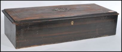 A 19th century cylinder music box of rectangular form with brass cylinder. The mahogany box with