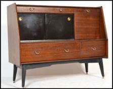 A 1970's G-Plan Librenza tola wood sideboard / credenza / highboard raised on an ebonised suspension