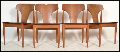 Elliots of Newbury - A set of four vintage 20th century teak dining chairs having black vinyl