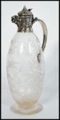 A fantastic 19th century silver hallmarked claret jug raised on a circular base with bulbous body.
