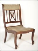 An Edwardian mahogany inlaid bedroom / nursing chair having line inlaid details with green velour