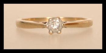 A hallmarked 9ct gold diamond solitaire ring having a central brilliant cut diamond of approx 25pts.