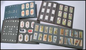 A selection of mid 20th century cigarette card albums to include a selection of Wills's