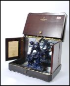 A Remy Martin Champagne Cognac porcelain decanter, in the form of a centuar with a cobalt blue