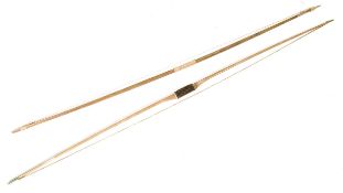 TWO VINTAGE BRITISH MADE WOODEN LONGBOWS