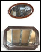Two vintage early 20th Century wall hanging mirrors, the first or rectangular form having a large