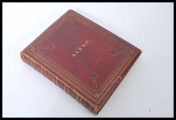 A Victorian 19th century red leather gilt tooled bound scrap album / decoupage. Containing various