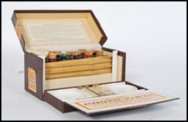 An early 20th century Johnson & Sons box of Photo Tints for colouring postcards, prints and