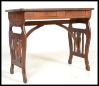 A 19th Century folding mahogany table / desk having metamorphic shaped supports, possibly