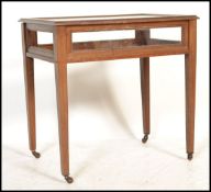 An Edwardian mahogany inlaid bijouterie table / display cabinet. Raised on square tapered legs